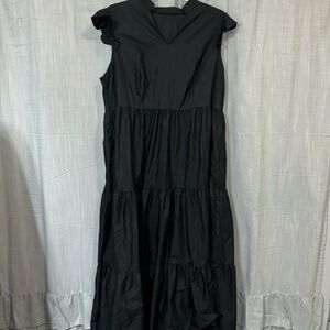 Ruffled shoulder black dress